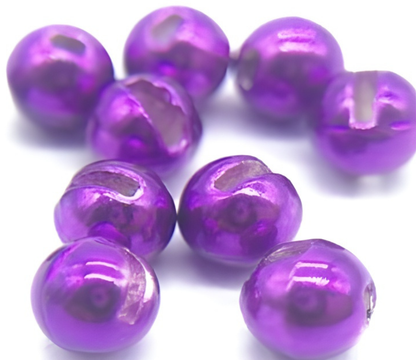 Metallic purple beads on a white background